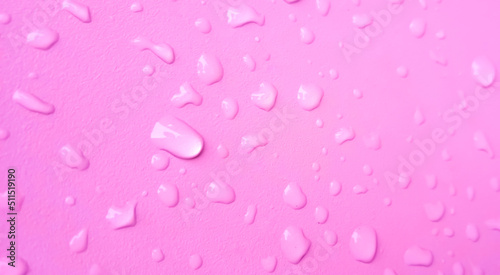 Abstract water drops on the pink wall. Suitable for promotion and advertising, website, tech industry and company, etc.