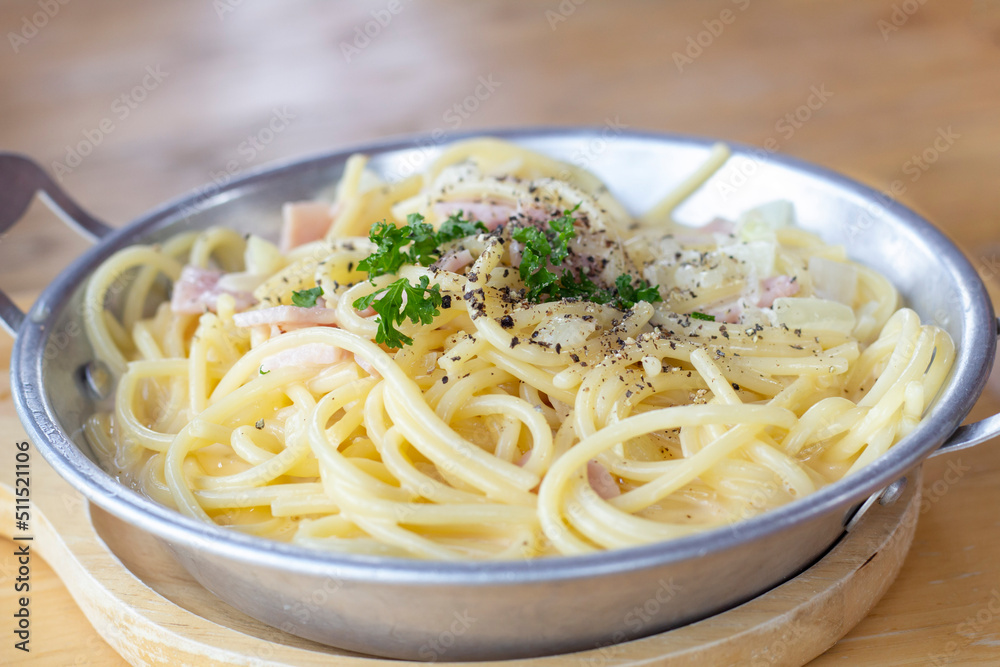 Closeup Spaghetti Carbonara in plate on wooden table at the restaurant. Closeup Spaghetti Carbonara in plate on wooden table at the restaurant.