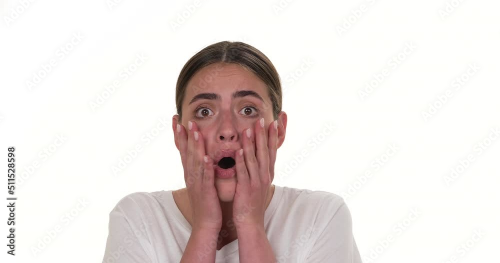 Portrait of a woman is looking at camera showing surprised expression. Isolated on white background.
