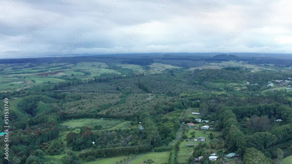 Wide aerial dolly shot of rural rainforest and farmland on the Big Island of Hawaii. 4K Wide aerial dolly shot of rural rainforest and farmland on the Big Island of Hawaii. 4K