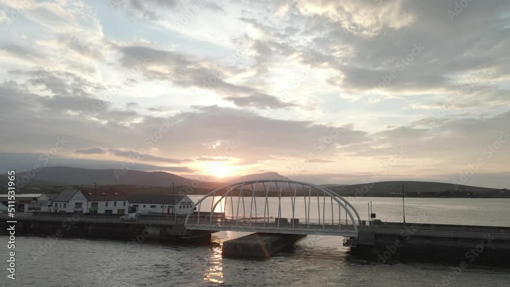 Flying Towards Michael Davitt Bridge With Scenic Sunset View In Achill Island, Ireland. - aerial forward Flying Towards Michael Davitt Bridge With Scenic Sunset View In Achill Island, Ireland. - aerial forward