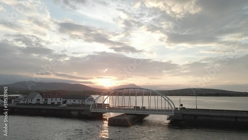 Flying Towards Michael Davitt Bridge With Scenic Sunset View In Achill Island, Ireland. - aerial forward photo