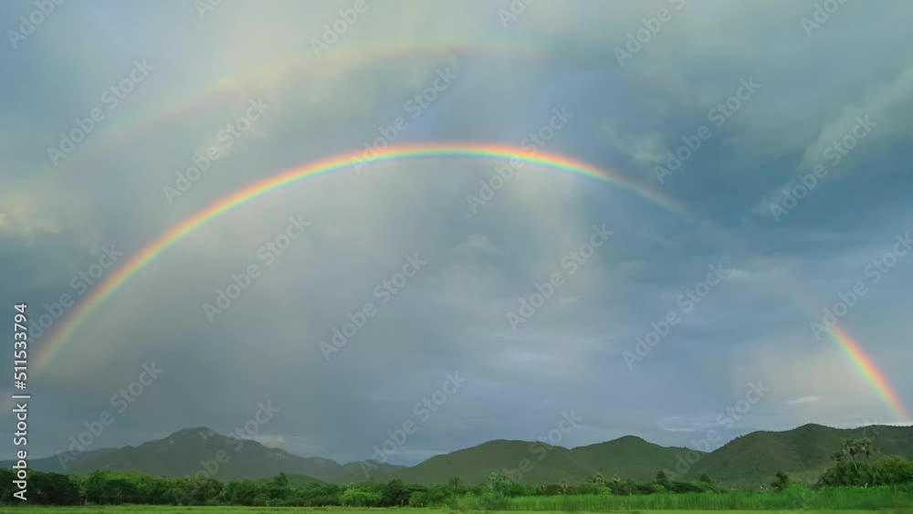 Beautiful Double Rainbows On Rainy Sky Time Lapse (zoom out) Beautiful Double Rainbows On Rainy Sky Time Lapse (zoom out)