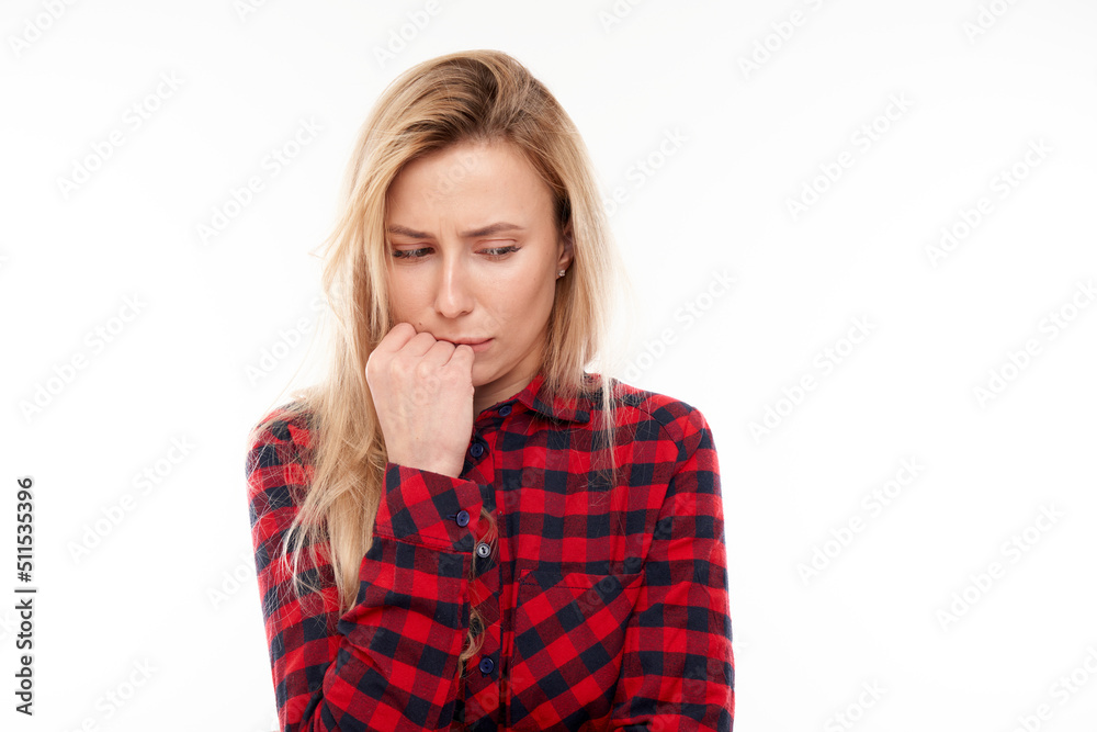 Smart blonde girl in casual holding chin thinks doubts, makes decision isolated on white studio background Smart blonde girl in casual holding chin thinks doubts, makes decision isolated on white studio background