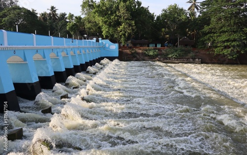 Beautiful view of river water flowing out of the dam. photo