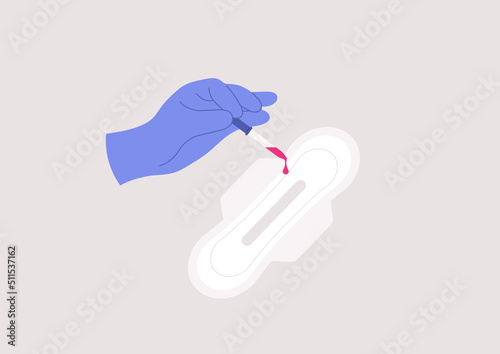 A hand in a sterile glove testing a sanitary pad absorbent quality with a dropper, a clinical research