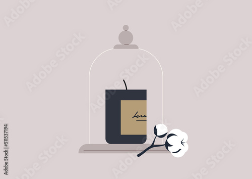 A cotton scented candle under the vintage glass dome, a boutique product