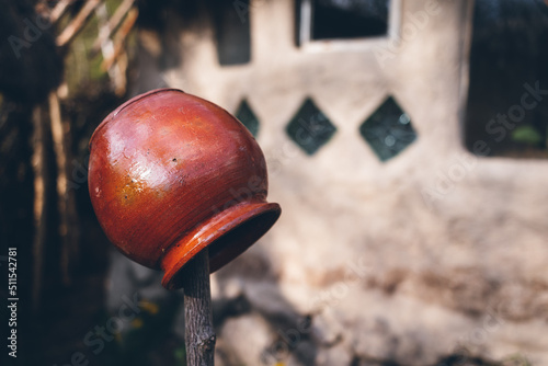 Ceramic pot. An old clay pot is dried in the yard.