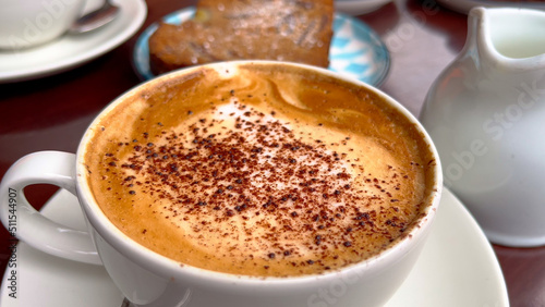 Cup of Cappucino at a street cafe - close up view - travel photography