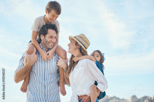Look at our perfect little family. Cropped shot of an affectionate couple carrying their two children during an enjoyable day out on the beach. © Allistair F/peopleimages.com