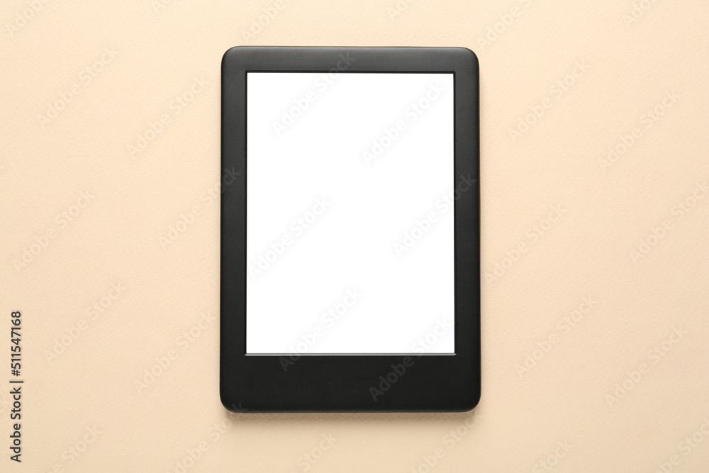 Modern e-book reader with blank screen on beige background, top view Modern e-book reader with blank screen on beige background, top view