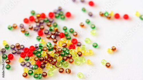Glass beads mix isolated on white background. Different colors. 