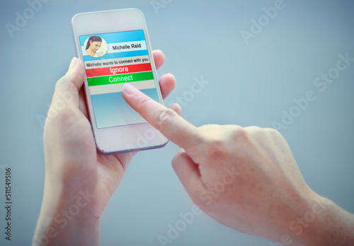 A cropped shot of someone using a social app on their smart phone. All screen content is designed by us and not copyrighted by others, and upon purchase a user license is granted to the purchaser. A