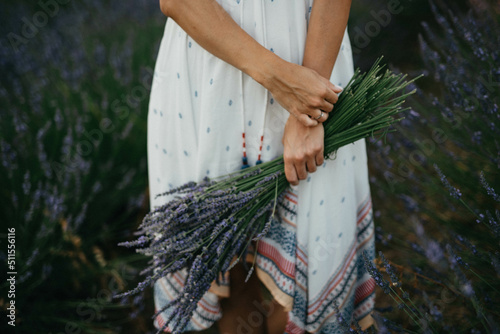 Beautiful happy girl walking by the field.
