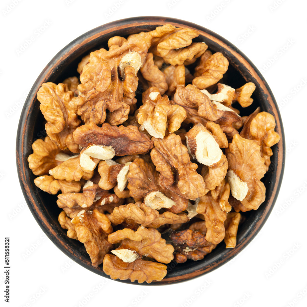 Plate with tasty walnuts isolated on a white background, close up. File contains clipping paths. Top view. Plate with tasty walnuts isolated on a white background, close up. File contains clipping paths. Top view.