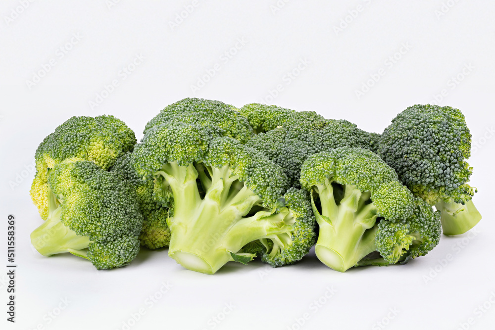 A lot of broccoli inflorescence on white background isolated. A lot of broccoli inflorescence on white background isolated.