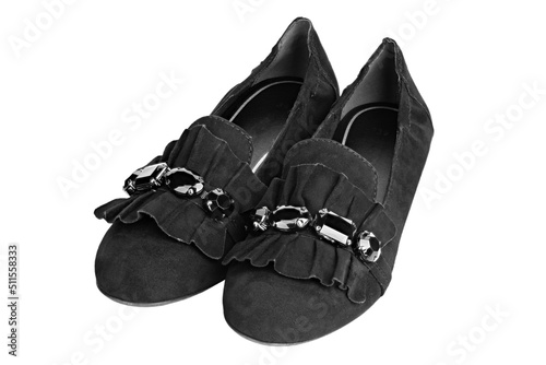 Women's black suede moccasins isolated in white background. Classic design, traditional silhouette.