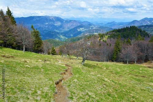 Scenic view of mountain Ratitovec from a meadow bellow bellow Porezen in Gorenjska, Slovenia photo