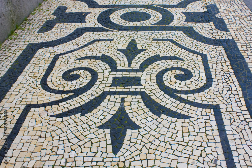 Traditional pattern cobblestone pavement (calada portuguesa) in Porto, Portugal	

