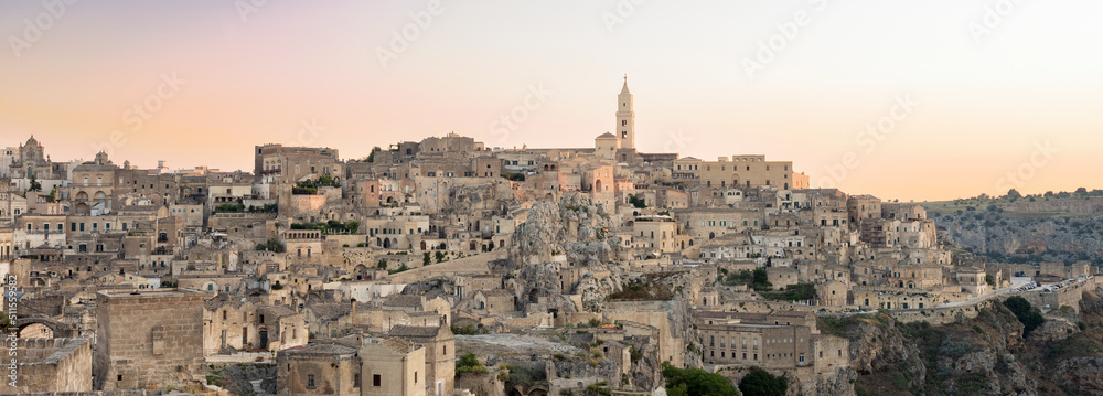 Fototapeta premium Stunning view of the village of Matera during a beautiful sunrise. Matera is a city on a rocky outcrop in the region of Basilicata, in southern Italy.