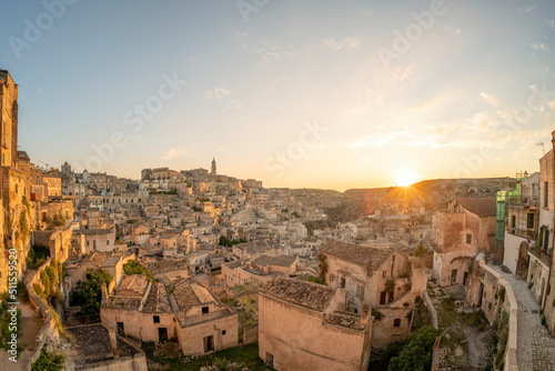 Stunning view of the village of Matera during a beautiful sunrise. Matera is a city on a rocky outcrop in the region of Basilicata, in southern Italy. © Travel Wild