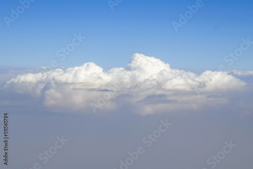 View of fluffy clouds from plane. Copy space. Close-up. Selective focus. © Marina_Nov