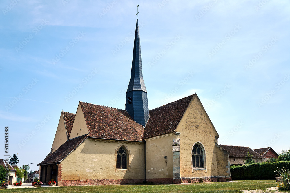 stone medieval church with a bell tower in Champagne