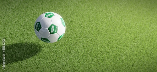 Football or soccer ball design with flag of Saudi Arabia against grass pitch backdrop. 3D rendering