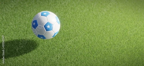 Football or soccer ball design with flag of Somalia against grass pitch backdrop. 3D rendering
