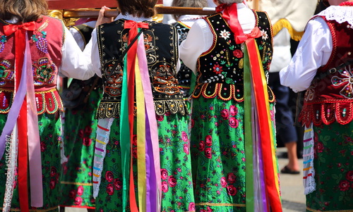 Photography Woman in traditional Polish folk costumes while join Corpus Christi procession i