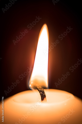 burning candle in the dark