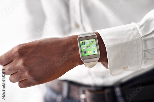 Taking technology on the go. Cropped view of a man wearing a smartwatch - All screen content is designed by us and not copyrighted by others.