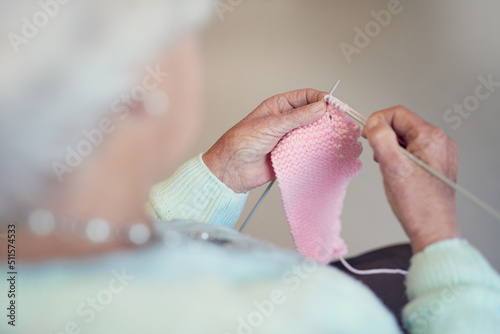Shes been knitting through the years. Closeup shot of an unrecognisable senior woman knitting.