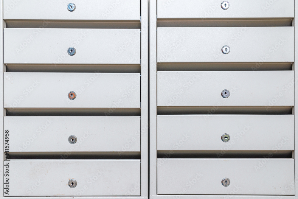The metal boxes for newspaper,mail in the entrance of a residential building. The metal boxes for newspaper,mail in the entrance of a residential building.