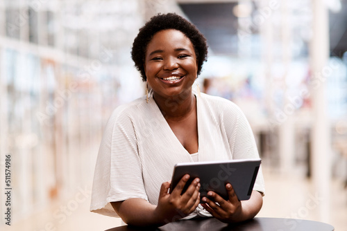 Its easy to stay inspired with the smartest tools. Portrait of a young businesswoman using a digital tablet in an office. photo