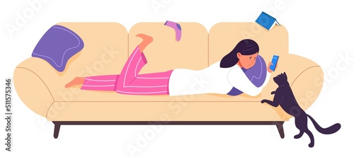 Social media addiction. Girl laying on sofa with smartphone instead of playing with cat
