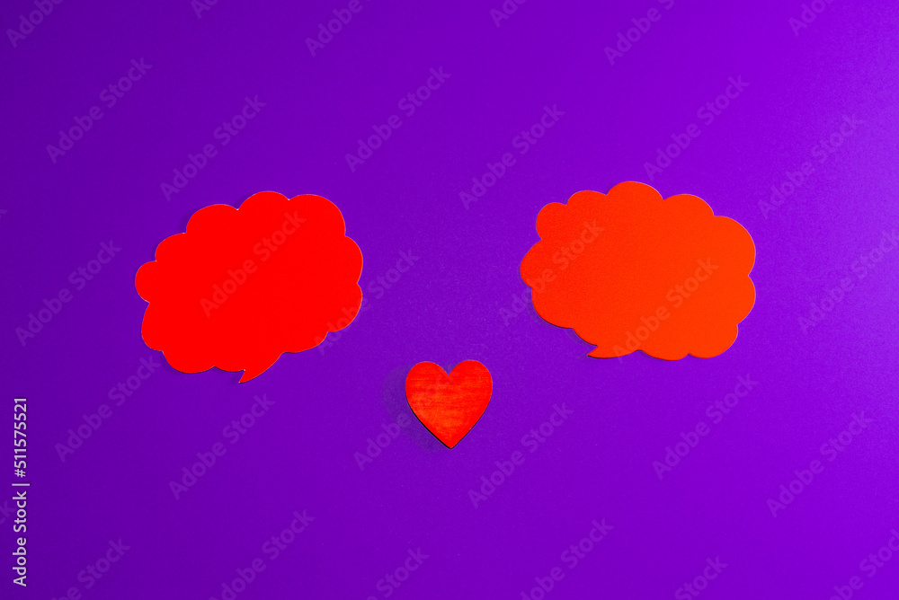Red clouds,heart for Valentine's day concept.Communication red heart between two clouds. Purple,veri peri background.Place for your text. Copy space.
