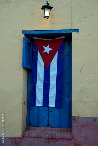 cuban flag at a door in trinidad © chriss73