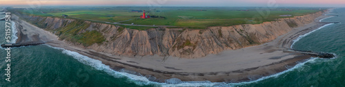 Valokuva Scenic view of the cliffs at the danish coast with the red lighthouse Bovbjerg Fyr