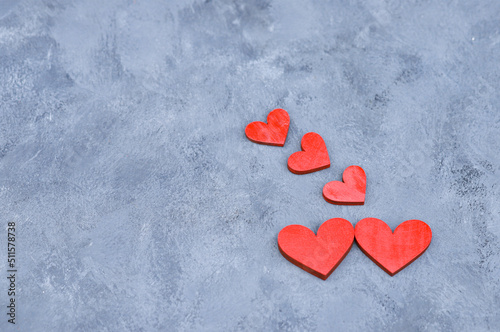 Red hearts on a blue background. Romantic, greeting card for the wedding. Wedding. Love.