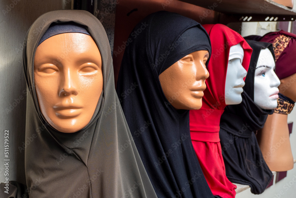 Traditional muslim scarfs known as kerchief on plastic mannequins at a street market in Turkey