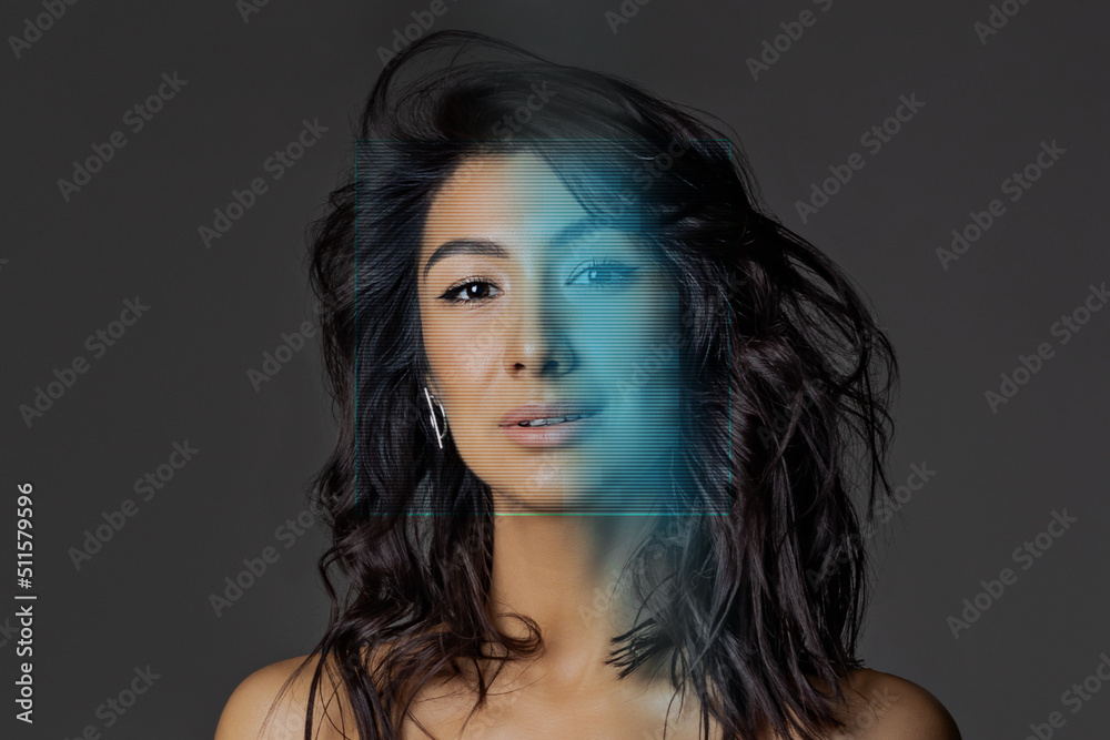 Beauty face with nude makeup. Smiling asian woman with wavy long black hair close up on gray background