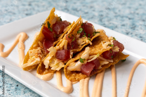 A Plate of Asian Ahi Tacos in Fried Wonton Wrappers photo