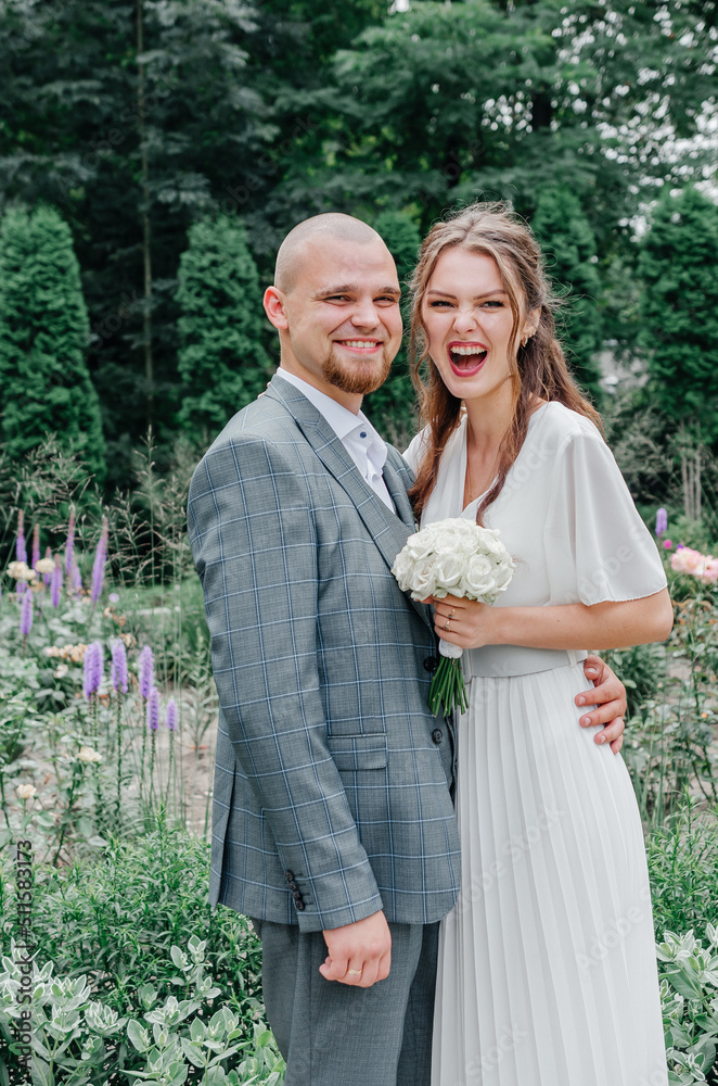 cheerful brides smile and hug cheerful brides smile and hug