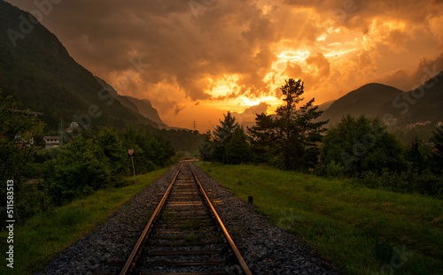 Railroad tracks in the setting sun photo