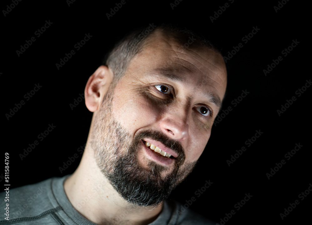 Portrait of 40 years old man on a black background. High quality photo Portrait of 40 years old man on a black background. High quality photo