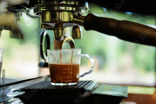 espresso machine pouring coffee