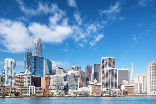 Boat level view of San Francisco, California downtown district and its skyscrapers and San Francisco bay in early morning
