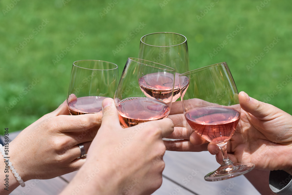 Group of people toasting with glasses of wine