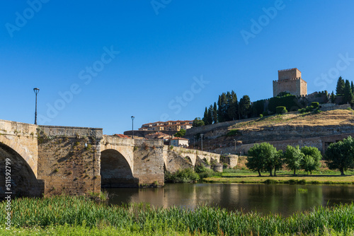 View of Ciudad Rodrigo with its river, bridge and castle. In Salamanca, Spain photo